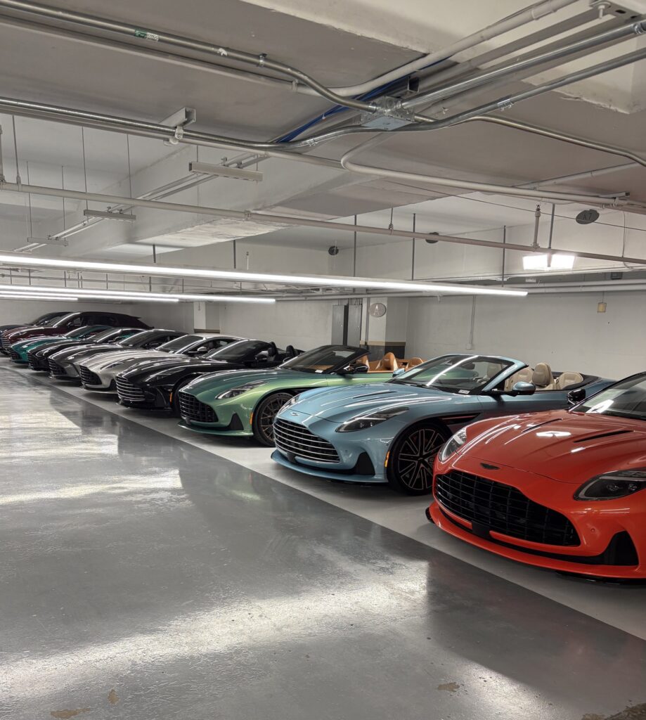 Row of sports cars parked in an underground hall